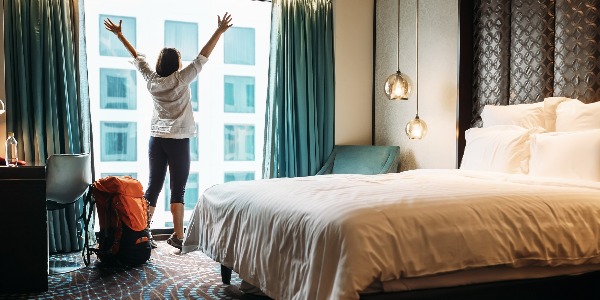 Backpacker traveller happy to stay in five star hotel