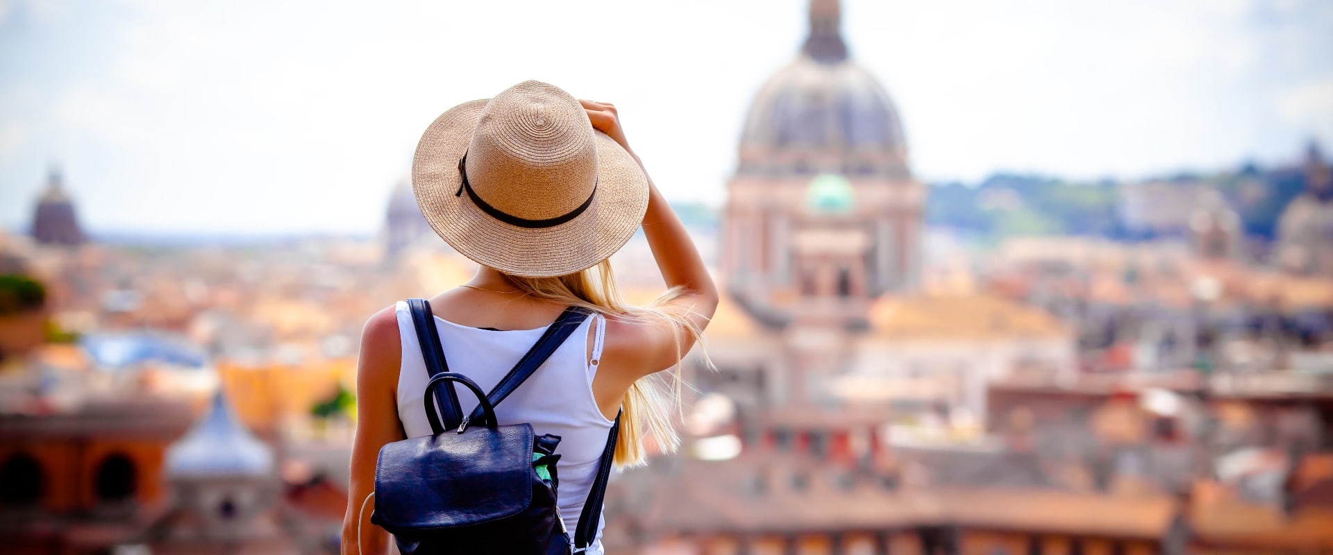 Rome Europe Italia travel summer tourism holiday vacation background -young smiling girl with mobile phone camera and map in hand standing on the hill looking on the cathedral Vatican